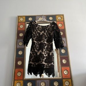 Black lace minidress with nude underlay